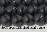 CAA3655 15.5 inches 6mm round matte & carved black agate beads