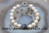 CFB1050 Hand-knotted 9mm - 10mm potato white freshwater pearl & sodalite bracelet