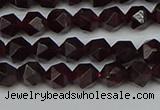 CNG7275 15.5 inches 6mm faceted nuggets red garnet beads